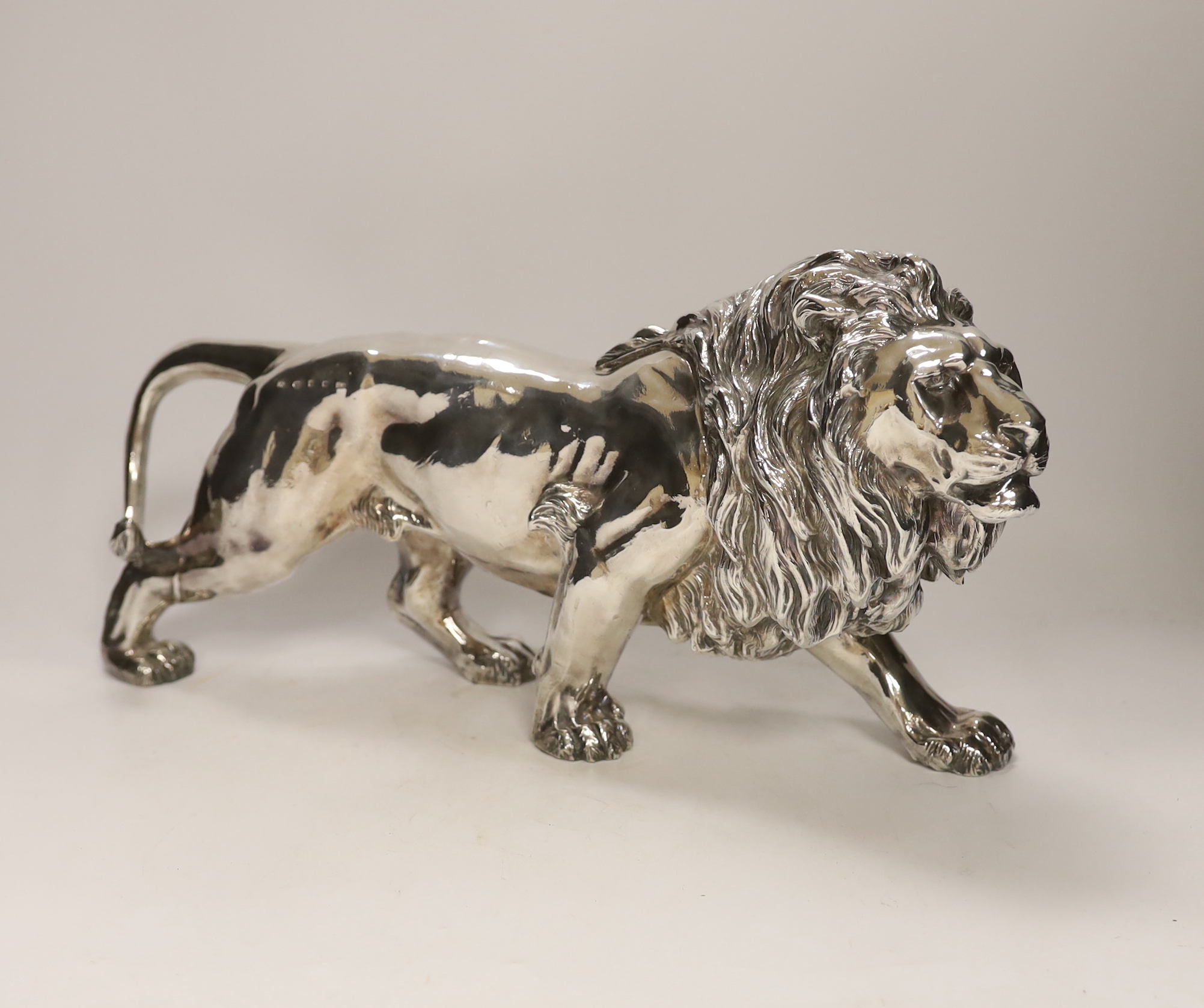 A large modern silver (filled) model of a lion, Camelot Silverware Ltd, London, 2008, 40cm long